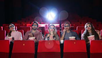 Friends watching movie in cinema�