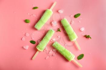 Delicious popsicles on color background�