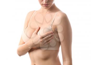 Young woman with beautiful breast on white background�
