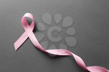 Pink ribbon on grey background. Breast cancer awareness concept�