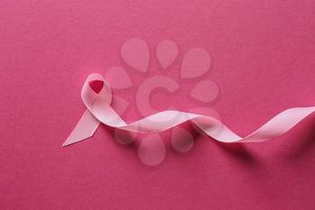 Pink ribbon on color background. Breast cancer awareness concept�