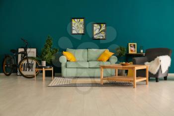 Stylish interior of living room with comfortable sofa�