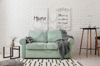Stylish interior of living room with comfortable sofa�