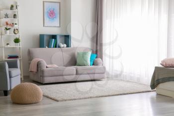 Interior of beautiful room with comfortable sofa�