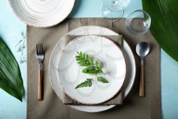 Simple table setting on color background�