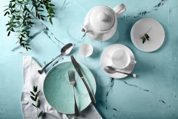 Simple table setting on color background�