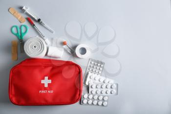 First aid kit on light background�