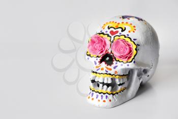 Painted human skull for Mexico's Day of the Dead on white background�