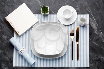 Simple table setting on grey background�