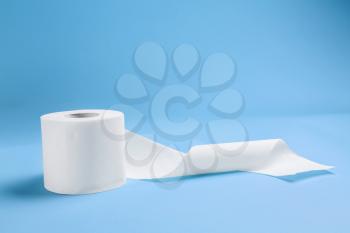 Roll of toilet paper on color background�