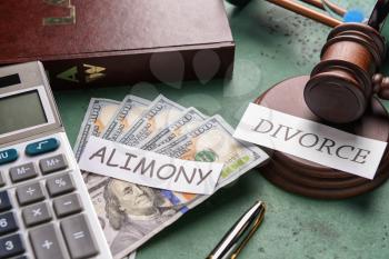 Composition with words ALIMONY and DIVORCE, money and calculator on color background�