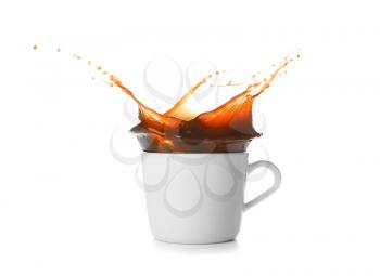 Splash of coffee in cup on white background�