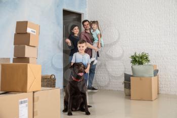 Family unpacking things after moving into new house�