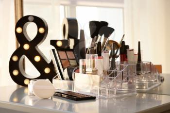 Dressing table with professional makeup cosmetics and brushes�