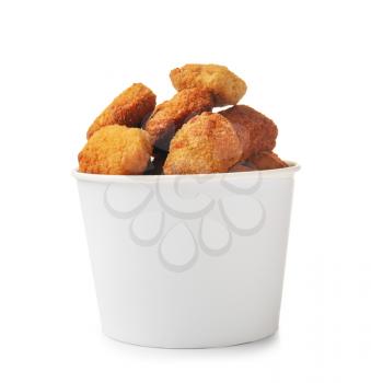 Tasty nuggets in paper bowl on white background�