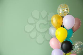 Many balloons on color background�