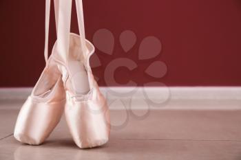 Ballet shoes on floor indoors�