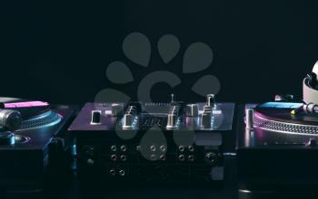 Modern DJ mixer on dark background�