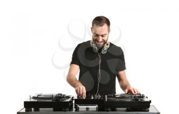 Male DJ playing music on white background�
