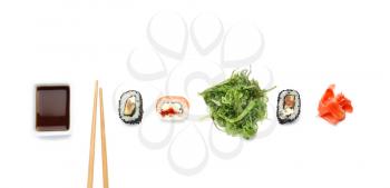 Composition with tasty sushi rolls on white background�