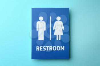 Unisex restroom sign board on color background. Concept of transgender�