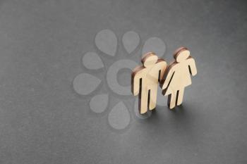 Female and male figures on dark background. Concept of transgender�