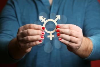 Man with manicure showing symbol of transgender, closeup�