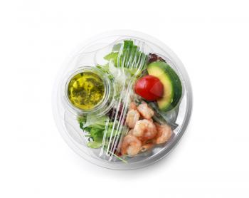 Container with delicious food for delivery on white background�