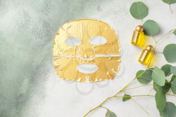 Sheet facial mask with essential oil on light background�