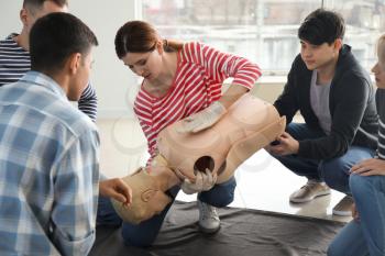 People learning to provide first aid at training course�