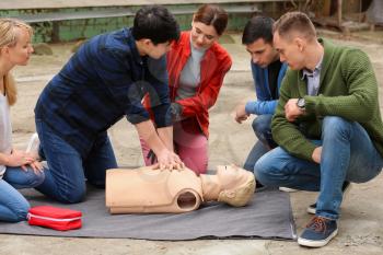 People learning to perform CPR at first aid training course�