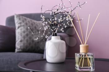 Reed diffuser on table in room�