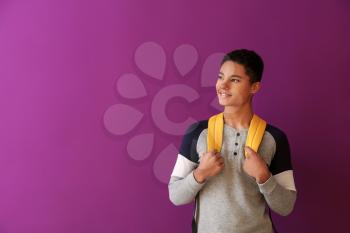 African-American schoolboy on color background�