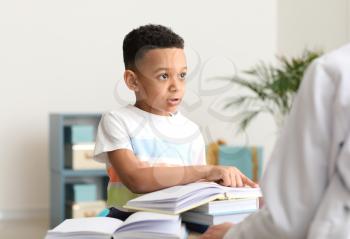 Little boy at speech therapist office�