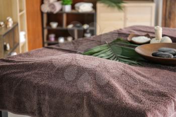 Massage table in spa salon�