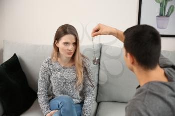 Young woman during hypnosis session in psychologist's office�