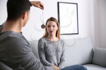 Young woman during hypnosis session in psychologist's office�