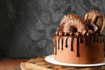 Sweet chocolate cake on table�