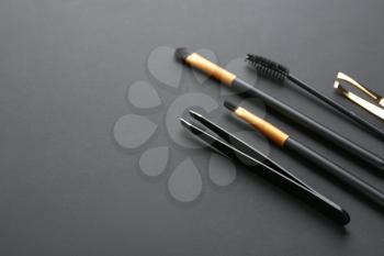 Set of tools for eyebrows correction on grey background�