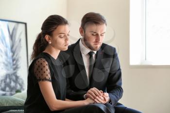 Couple pining after their relative after funeral�