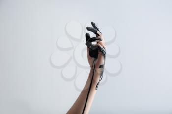 Painted hand on light background�