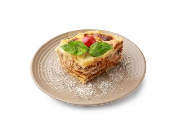 Plate with tasty baked lasagna on white background�