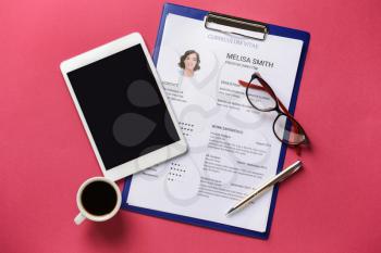 Job resume with tablet PC on color background�