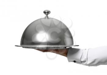 Hand of waiter with tray and cloche on white background�