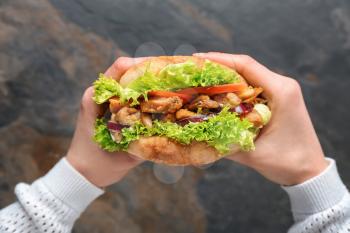 Female hands with tasty doner kebab, closeup�