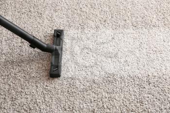 Brush of vacuum cleaner on carpet�