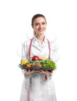 Portrait of female nutritionist with healthy products on white background�