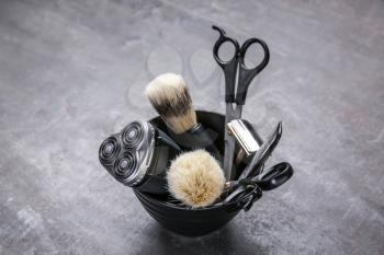 Set of male shaving accessories on grey background�