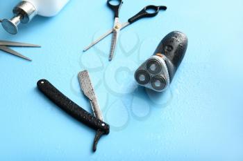 Set of male shaving accessories on color background�