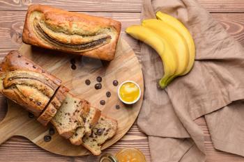 Tasty banana bread on wooden table�